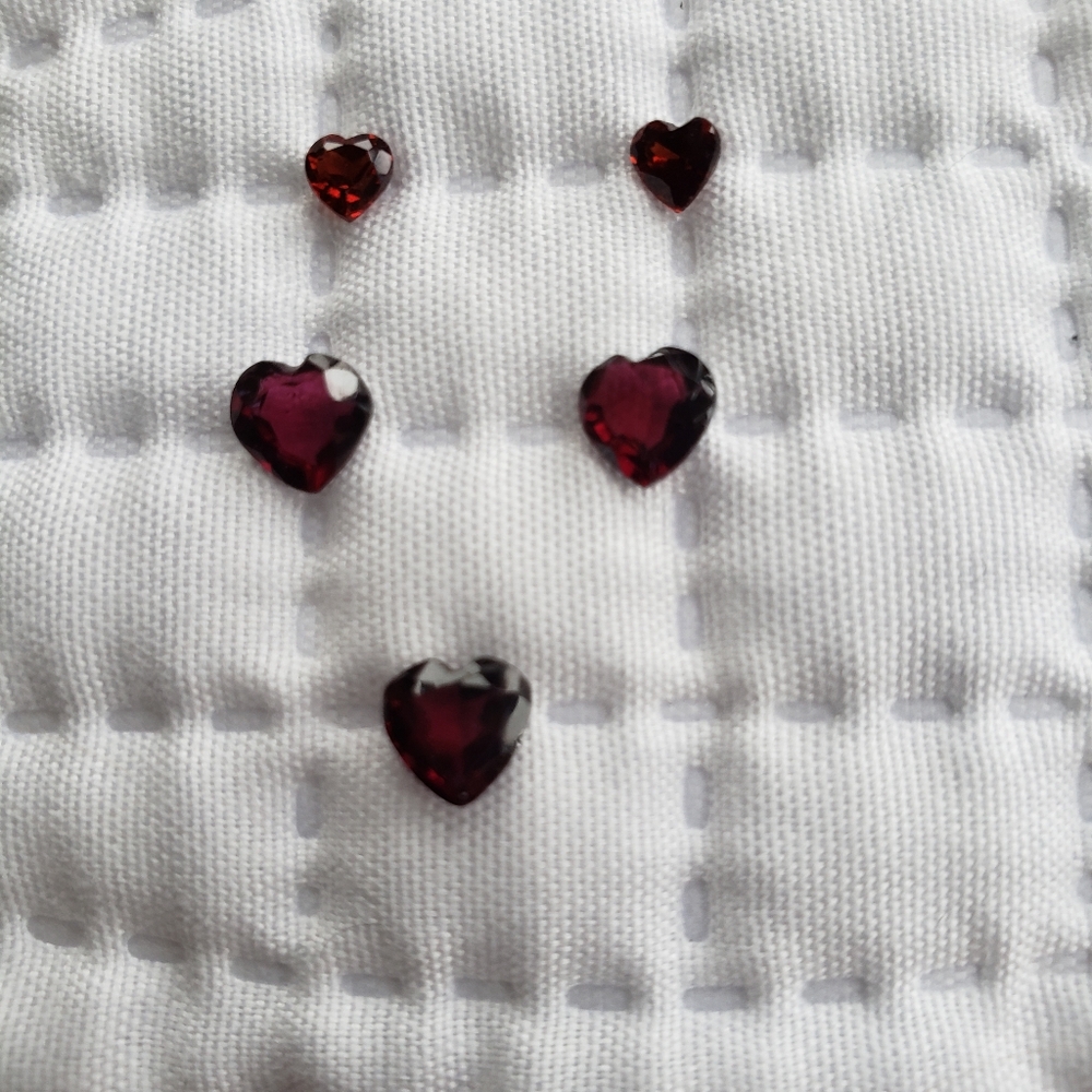 Garnets. A Parcel Of 5 Deep Red Heart Shaped Faceted Garnets.